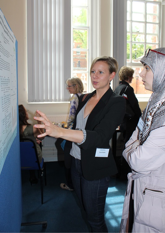 NRI PhD student, Jane Robb (left) presents her research poster to fellow student, Hajar El Hamss (right) | Photo: G Summers