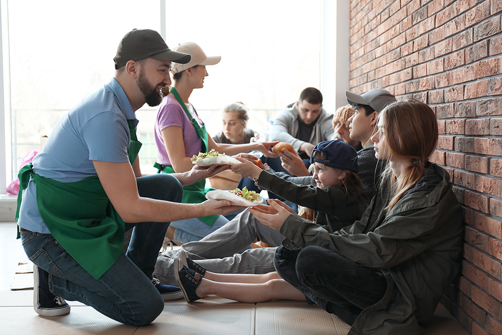 Volunteers serving food at a food bank. Food poverty is a reflection of broader societal inequalities