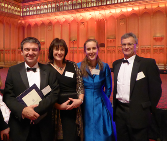 Kathy (in blue) with some of her NRI collaborators at a Queen’s Anniversary prize ceremony 